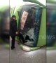 Car hits bus, flipping it over and trapping passengers inside