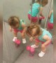 This little girl doesn't quite understand mirrors