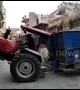 Whoops! Tractor driver gets stuck in between houses