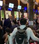 Chaos in Thai airport as stranded tourists rush to leave islands