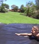 Young Australian girl makes slip 'n slide for cousins