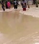 Retrieving a Motorcycle from Flooded Road