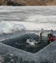 Russian man swims 25m under ice at world's deepest lake