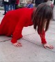 Mystery of the "lady in red" filmed crawling across Parliament Square in London