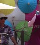 Tourists enjoy colourful umbrella festival in northern Thailand