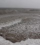 Winter storm creates thousands of floating "ice balls"