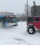 Team of Trucks Saves a Bus