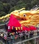 99-metre-long dragon dances on glass bridge to celebrate two world records having been created