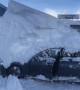 Parked car reverses while under 6ft-high snowdrift in Austrian hotel car park