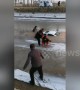 Villagers save man trapped in car that fell into icy river