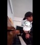 Cat learns piano in cutest duet ever