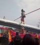 Kung fu master walks and does balance tricks on giant knife-edge