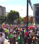 Thousands of Venezuelans march in Caracas to demand humanitarian aid be allowed to enter country