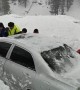 Rescuers save three vehicles buried in massive avalanches in China