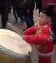 Chinese boy shows off impressive drumming skills at temple fair