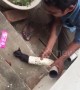 Indian man rescues kitten trapped in washing machine pipe
