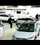 Customer smashes through car showroom window at dealership in India