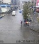 Good samaritans carry children across flooded road in China’s Guangdong