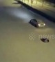 Girl riding tyre gets dragged along snowy road by her father in car in China's Henan