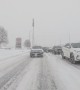 Fresh snowstorm strikes Ontario,Canada as traffic slides over roads