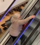 Mom Exercises on the Escalator