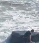Surfer Struggles Against Pounding Waves