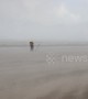 Dramatic moment storm hits Northern Ireland coast, leaving beach-goers battling horizontal hail and sand