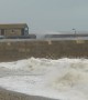 Waves break over harbour wall in Lyme Regis during Storm Freya