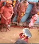 Women beat men with sticks during traditional north Indian festival