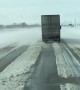 Heavy Winds Blow Trailer Around a Highway