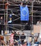 Supporters for a People's Vote mount scaffolding and hold EU flag aloft
