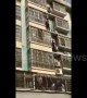 Heroic men climb four floors on building exterior to rescue child hanging from window