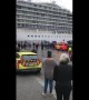 Onlookers cheer as Viking Sky cruise ship is towed into Norwegian port of Molde