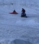 Snowmobile Plunges Passenger into Pond