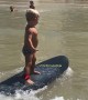 Cool Kid Surfs to Shore