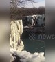Veteran pro diver leaps from freezing 65ft-high waterfall