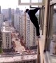 Robber tries to escape police climbing out of 22nd-floor window in China's Hunan