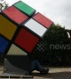 Ingenious UK man solves giant Rubik's Cube from the INSIDE
