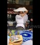 Kung fu master shows off Tai Chi moves while spinning roti pirata dough