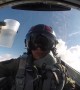 Pilot drinks water from cup while flying upside down