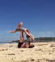 Aussie man makes surprise proposal to his girlfriend during beach 'acro-yoga'