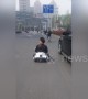 Miniature motorist? Chinese man drives go-kart along busy road