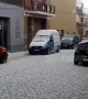 Unseasonal hailstorm pummels cars parked on a street in Barcelona