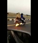 Indian family rides down highway on burning motorbike