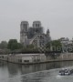 Media and tourists gather at Notre Dame on morning after fire