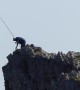 Spanish fishermen risk their lives catching sea bream from top of steep cliff