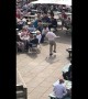Having the time of his life! Elderly man dances in front of crowd in beer garden