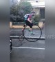 Melbourne man in full cycle gear surprises commuters on Penny-farthing