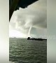 Large waterspout swirls through the sea off Thai island