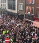 Homophobic nail-bomb attack remembered by defiant crowd-rousing street choir